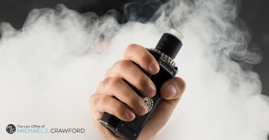 person holding vape pen